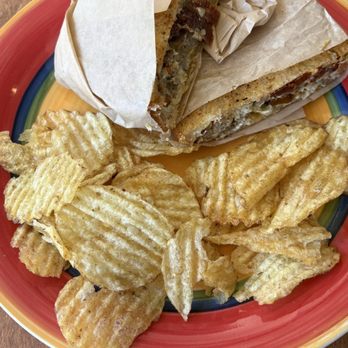 Chase Gardens Cafe and Bistro - Lamb of Goud sandwich with chips. - Breakfast & Brunch Near Me - Eugene, Oregon Chase Gardens Cafe and Bistro - Lamb of Goud sandwich with chips. - Breakfast & Brunch Near Me - Eugene, Oregon