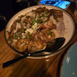 Shrimp and grits. My wife loved it, but said she would order it next time.With the grits, separate from everything else. Shrimp and grits. My wife loved it, but said she would order it next time.With the grits, separate from everything else.