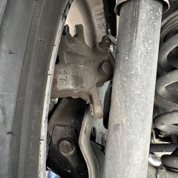 Lopez Tires & Service - Brake caliper hanging - Auto Repair Near Me - San Leandro, California Lopez Tires & Service - Brake caliper hanging - Auto Repair Near Me - San Leandro, California
