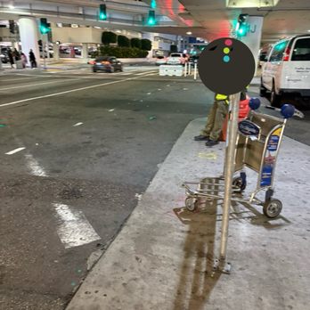 LAX Terminal 4 - Man sitting not working - Airport Terminals Near Me - Los Angeles, California LAX Terminal 4 - Man sitting not working - Airport Terminals Near Me - Los Angeles, California