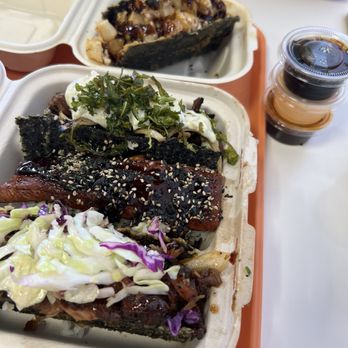 Musubi Square - Top to bottom: Crispy Calamari Taco, Wagyu Feta Taco, Grilled Unagi Taco, Spicy Yuzu Pork Ribs Taco  One of each side sauce - Asian Fusion Near Me - Anaheim, California