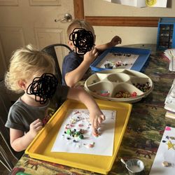 Donna's Learning Center - Children doing a fine motor skill craft activity