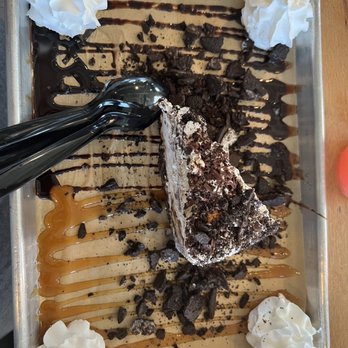Smoke & Fire Social Eatery - BOMB mud pie! Basically Oreo crust w/mocha icecream w/almonds in it topped with more Oreo crumbs, chocolate/caramel syrup and whip cream - Comfort Food Near Me - Paramount, California Smoke & Fire Social Eatery - BOMB mud pie! Basically Oreo crust w/mocha icecream w/almonds in it topped with more Oreo crumbs, chocolate/caramel syrup and whip cream - Comfort Food Near Me - Paramount, California