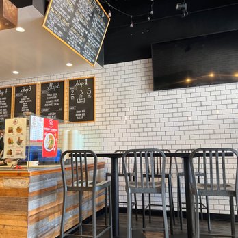 Poké Chop - a restaurant counter with a menu on the wall - Poke Near Me - San Diego, California Poké Chop - a restaurant counter with a menu on the wall - Poke Near Me - San Diego, California