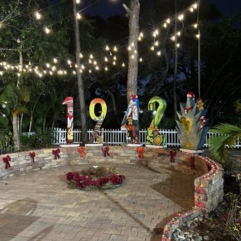 1942 Mexican Grill - Outdoor seating area by the pond with a fountain. - Cocktail Bars Near Me - Naples, Florida