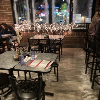 Sliceworks - tables and chairs in a restaurant - Pizza Near Me - Denver, Colorado Sliceworks - tables and chairs in a restaurant - Pizza Near Me - Denver, Colorado