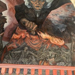 Palacio de Gobierno - Second floor looking out of stairway arch. Father Miguel Hidalgo y Costilla