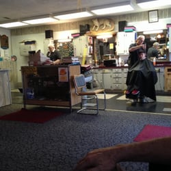 Chandler's Barber Shop - Tom and Dan, complete with their chairs that still have the ash trays in the arms :)