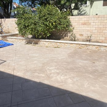 Noble Nest Construction - an empty patio with a blue tarp - Masonry/Concrete Near Me - Los Angeles, California Noble Nest Construction - an empty patio with a blue tarp - Masonry/Concrete Near Me - Los Angeles, California