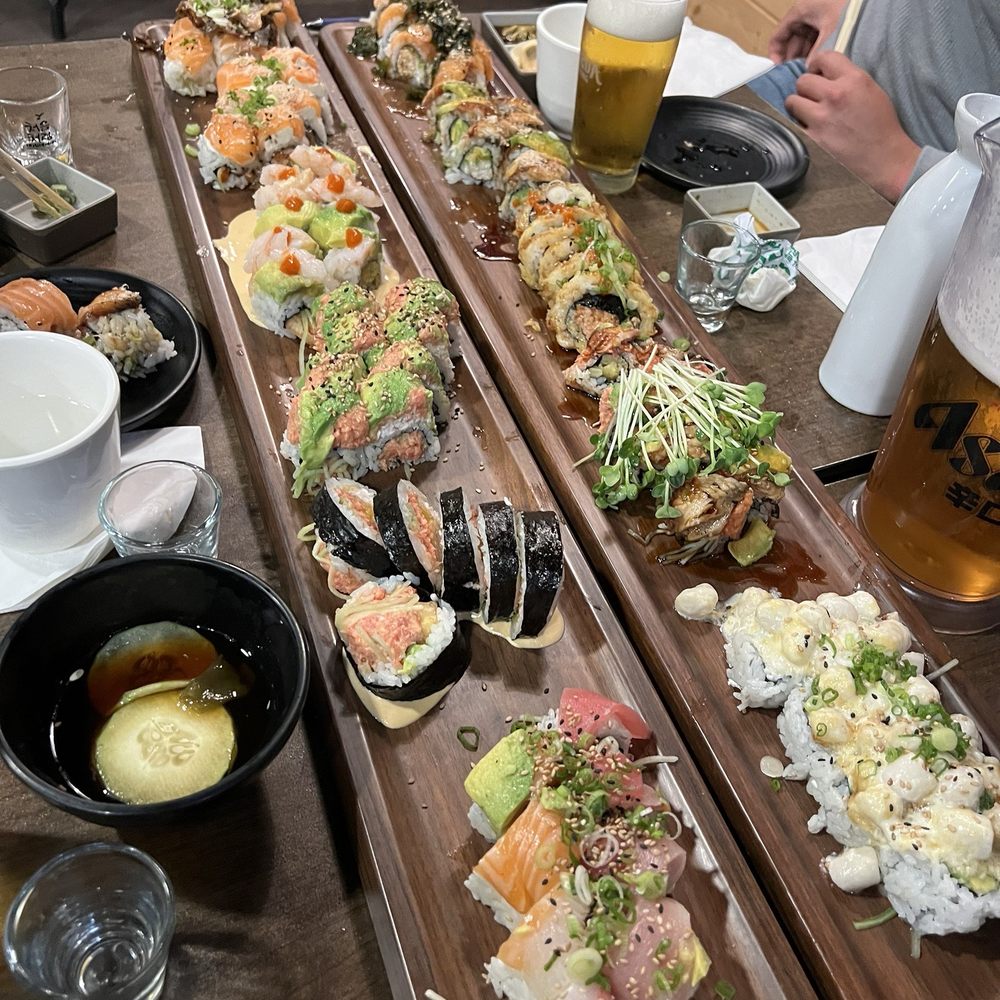Rainbow, baked scallop, s.l.o, tiger, dragon + many more rolls Rainbow, baked scallop, s.l.o, tiger, dragon + many more rolls