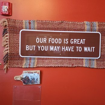 Campbell's Barn Restaurant & Saloon - a sign that says our food is great but you may have to wait - Bars Near Me - Amelia, Ohio