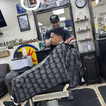 Razor Sharp Barbershop - Mauricio the barber action shot. Mid high taper fade. - Barbers Near Me - Artesia, California Razor Sharp Barbershop - Mauricio the barber action shot. Mid high taper fade. - Barbers Near Me - Artesia, California