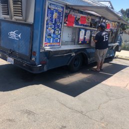 a man loading a food truck a man loading a food truck