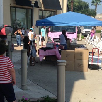 Hello Kitty Cafe - a little girl standing under a blue tent - Food Trucks Near Me - Sugar Land, Texas Hello Kitty Cafe - a little girl standing under a blue tent - Food Trucks Near Me - Sugar Land, Texas