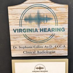 Virginia Hearing - This is the info on the entrance door including hours of operation. Photo taken July 8, 2025.