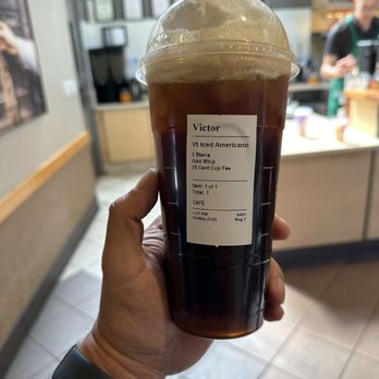 Starbucks - Venti Iced Caff Americano-with 25 cent cup fee and paper straws-got to love the Bay Area - Coffee & Tea Near Me - San Rafael, California