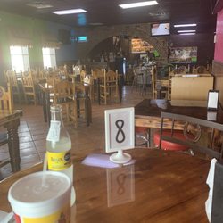 Pollos Asados Rio Grande - Under the tv area is a station for salsa and onions and other toppings