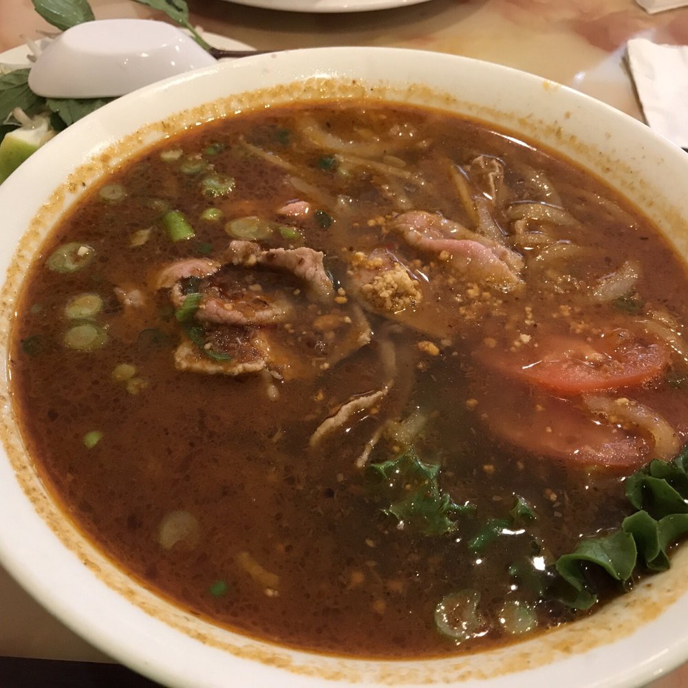 Mi La Cay - egg noodles with slices of eyeround steak, sliced tomatoes, and spicy sate sauce - Vietnamese Near Me - Silver Spring, Maryland