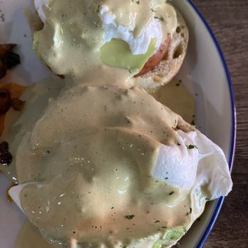 The Rooster - Classic Eggs Benedict: avocado, egg, egg muffin with ham and a side of some sweet and regular potatoes. - Breakfast & Brunch Near Me - Pearland, Texas The Rooster - Classic Eggs Benedict: avocado, egg, egg muffin with ham and a side of some sweet and regular potatoes. - Breakfast & Brunch Near Me - Pearland, Texas