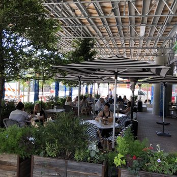 Flower Child - Outside seating (currently shaded by scaffolding from construction on the building above) - Salad Near Me - Austin, Texas