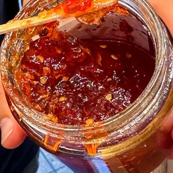 Micks Peppourri - a person holding a jar of jam - Specialty Food Near Me - Seattle, Washington