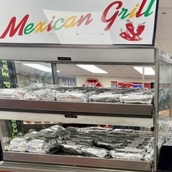 Mexican Grill - Breakfast is ready. Lots of burritos to grab and go.