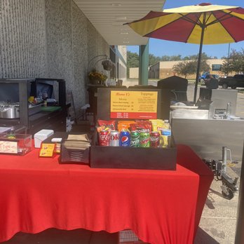 Mama V’s - a table with a red table cloth and a yellow umbrella - Food Trucks Near Me - Crystal Lake, Illinois Mama V’s - a table with a red table cloth and a yellow umbrella - Food Trucks Near Me - Crystal Lake, Illinois
