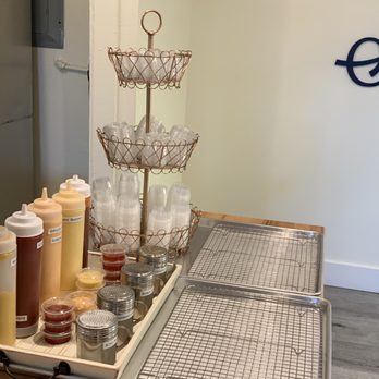 Seoul Hotdog - Condiment area to take Togo and pre packaged sauces, also powders you can apply - Hot Dogs Near Me - Berkeley, California