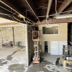 Tech Guys Computer IT Services - Pulling all CAT6 cables for cameras, access points and data with scissor lift.