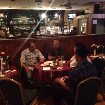 Caribbean Essence - a group of people sitting at a restaurant table - Sports Bars Near Me - Belleville, New Jersey Caribbean Essence - a group of people sitting at a restaurant table - Sports Bars Near Me - Belleville, New Jersey