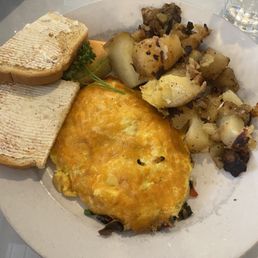 Veggie omelet with potatoes and sourdough toast Veggie omelet with potatoes and sourdough toast