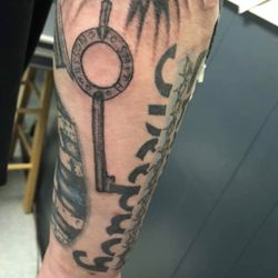 GoatHead Grafix - My Smith and Wesson handcuff key and part of the sheep dog tattoo . Artwork by Kevin Graf of Goathead Graffix tattoo.