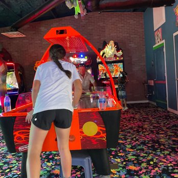 Bananas Mini Golf And Arcade - a girl playing a game - Mini Golf Near Me - Gulfport, Mississippi