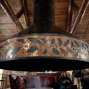 Johnny Seesaw's - The centerpiece fireplace inside the restaurant. - American Near Me - Peru, Vermont Johnny Seesaw's - The centerpiece fireplace inside the restaurant. - American Near Me - Peru, Vermont