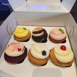 Top left to bottom right: Lemon, chocolate peanut butter, strawberry, red velvet, blueberry, and pineapple rightside up (gluten free) Top left to bottom right: Lemon, chocolate peanut butter, strawberry, red velvet, blueberry, and pineapple rightside up (gluten free)