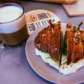 Parva Bakeshop Cafe - Multigrain Egg White Sandwhich w/ free drip coffee! and an oat milk cappuccino - Coffee & Tea Near Me - Jackson Heights, New York Parva Bakeshop Cafe - Multigrain Egg White Sandwhich w/ free drip coffee! and an oat milk cappuccino - Coffee & Tea Near Me - Jackson Heights, New York
