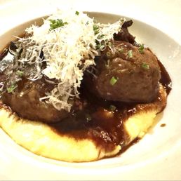 The meatballs...not spicy ones. On a bed of mashed. The meatballs...not spicy ones. On a bed of mashed.