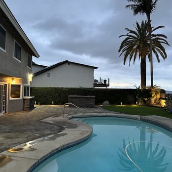 LMX Builders - a pool with a palm tree in the background - General Contractors Near Me - Irvine, California LMX Builders - a pool with a palm tree in the background - General Contractors Near Me - Irvine, California