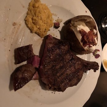 Harry's Steak House - Bone in ribeye (medium rare+), baked potato and creamed corn. - Steakhouses Near Me - Toronto, Ontario Harry's Steak House - Bone in ribeye (medium rare+), baked potato and creamed corn. - Steakhouses Near Me - Toronto, Ontario
