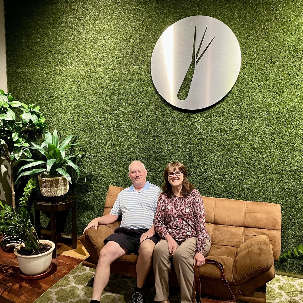 Lemongrass Thai Kitchen - Waiting area with logo on wall. (Models on sofa not included) - Thai Near Me - Oviedo, Florida Lemongrass Thai Kitchen - Waiting area with logo on wall. (Models on sofa not included) - Thai Near Me - Oviedo, Florida
