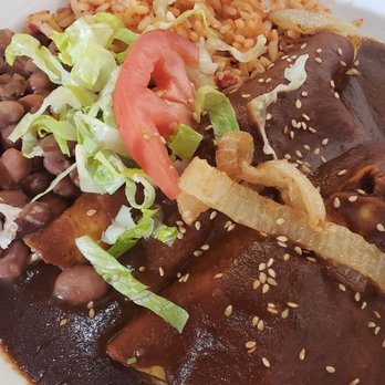 La Cueva Cafe - Pollo en mole enchiladas - Mexican Near Me - Taos, New Mexico La Cueva Cafe - Pollo en mole enchiladas - Mexican Near Me - Taos, New Mexico