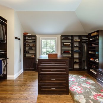 Symmetry Closets - Masculine dark wood tone with raised panel custom doors & drawers. - Home Organization Near Me - Holbrook, New York Symmetry Closets - Masculine dark wood tone with raised panel custom doors & drawers. - Home Organization Near Me - Holbrook, New York