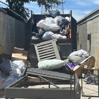 Villas at Legacy Apartments - Overflowing dumpster with smelly trash that was not maintained by the landlord or staff. - Apartments Near Me - Plano, Texas Villas at Legacy Apartments - Overflowing dumpster with smelly trash that was not maintained by the landlord or staff. - Apartments Near Me - Plano, Texas