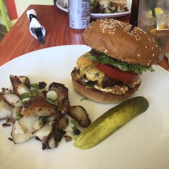 Simple Cafe - Burger, cheddar, house made pickles, sweet corn relish,sliced tomato, spring mix, remoulade on sesame potato bun - Breakfast & Brunch Near Me - Lake Geneva, Wisconsin