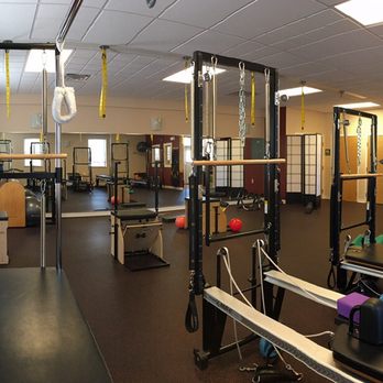Symmetry Pilates Center - Our studio is full of equipment with highly trained instructors to help you achieve your goals. - Pilates Near Me - Bedford, New Hampshire Symmetry Pilates Center - Our studio is full of equipment with highly trained instructors to help you achieve your goals. - Pilates Near Me - Bedford, New Hampshire
