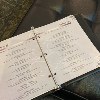 Stuffed Olive - a menu on a black leather chair - Tapas Bars Near Me - Cedar Falls, Iowa