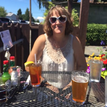 Rockfish Grill - Outdoor seating with an ice cold ice tea and Local brewed IPA. - Seafood Near Me - Anacortes, Washington