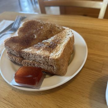 Sunset Grill - Toasted brown bread with butter along strawberry jam - Breakfast & Brunch Near Me - Newmarket, Ontario Sunset Grill - Toasted brown bread with butter along strawberry jam - Breakfast & Brunch Near Me - Newmarket, Ontario