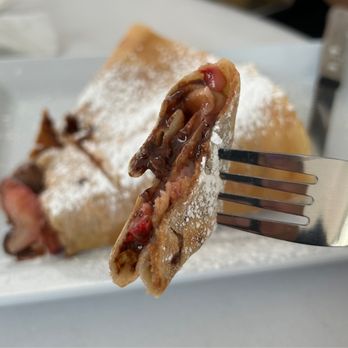 Rachel's Cafe & Creperie - a fork taking a bite out of a crepe - Creperies Near Me - Lancaster, Pennsylvania