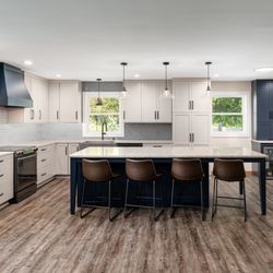 Kitchen Solvers - Full kitchen remodel with new cabinets, countertops, flooring, and tile backsplash.